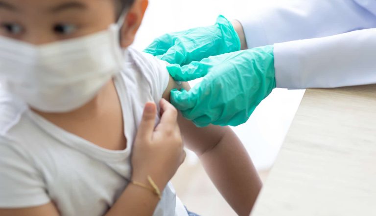 Asian little girl getting dengue vaccine. Pediatrician. pediatri